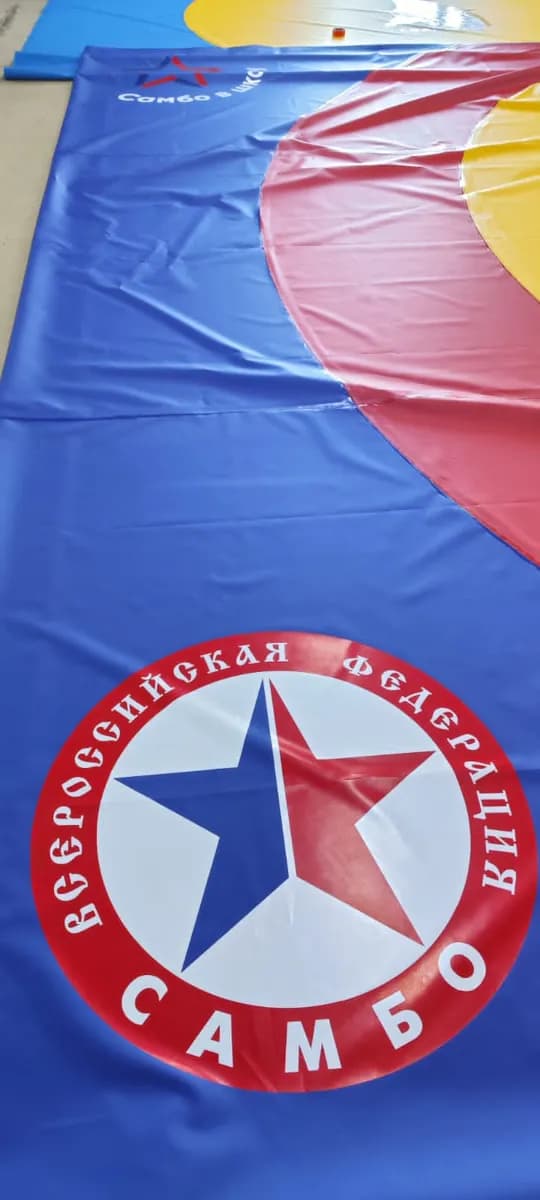 Нанесение логотипа на покрытие РОССАМБО