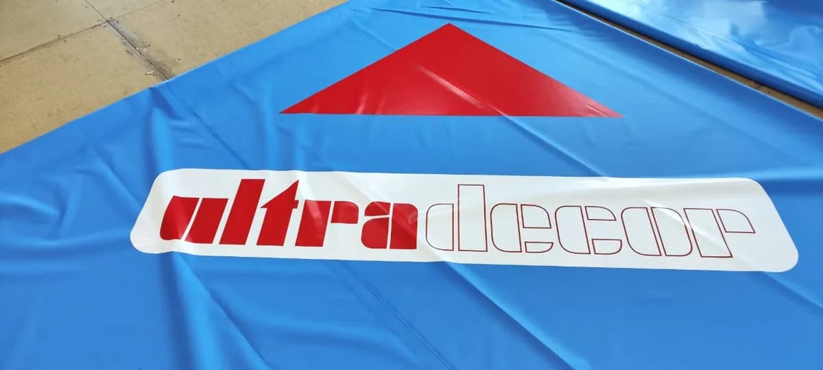 Нанесение логотипа на покрытие РОССАМБО